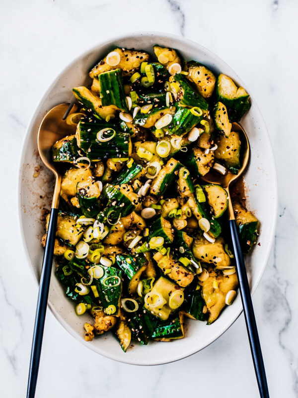 Smashed cucumber salad in serving bowl.