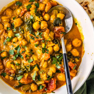 Bowl of chickpea curry with coconut milk.