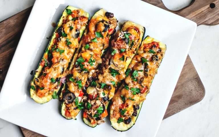 Tex Mex stuffed zucchini boats on a platter.