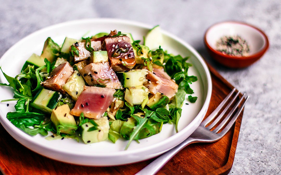 Close up of plate of grilled tuna steak salad.