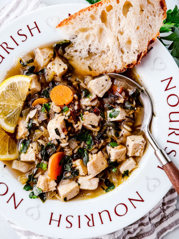 Turkey and wild rice soup in a bowl with a spoon.