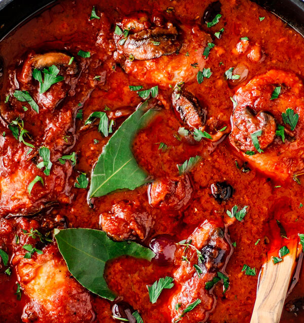 Boneless chicken cacciatore close up in pan.