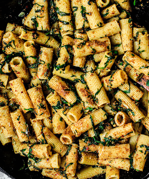 Skillet full of prepared rigatoni pasta.