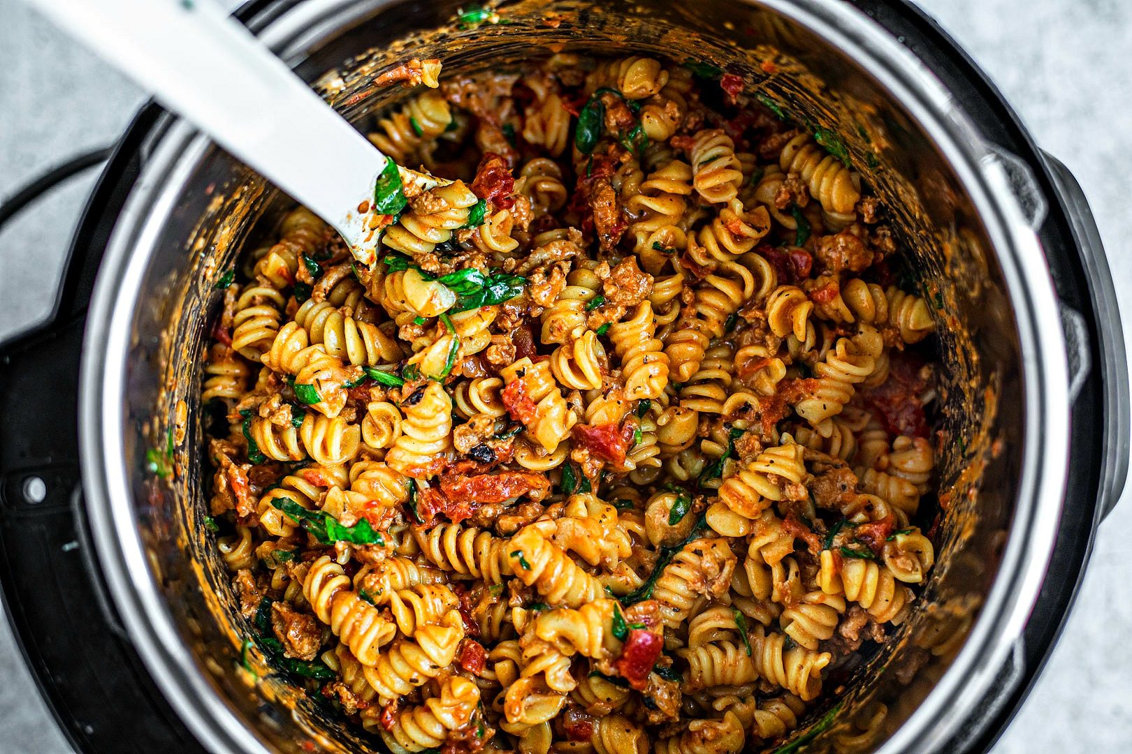 Instant Pot full of cooked creamy tomato pasta.