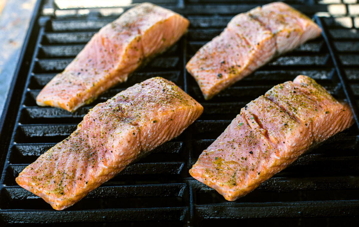 Salmon fillets on a grill.