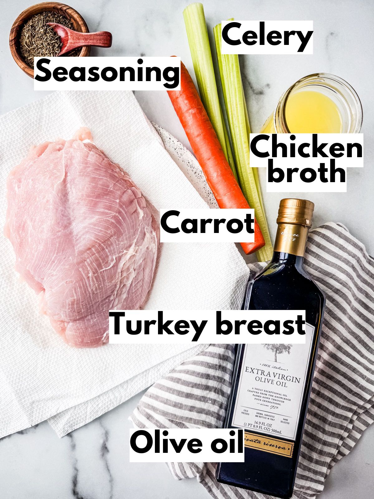 Ingredients for air fryer turkey breast on a white marble background.