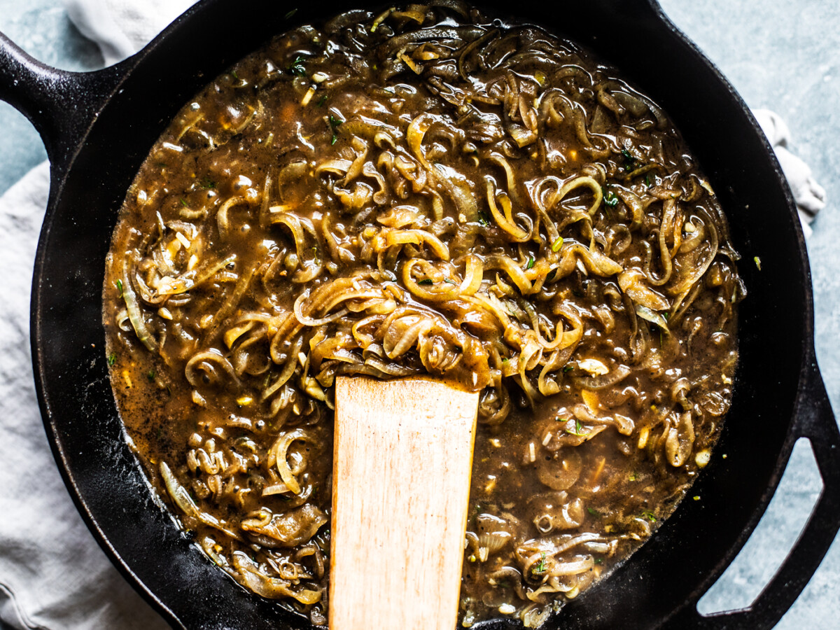 Cast iron skillet full of onion gravy.