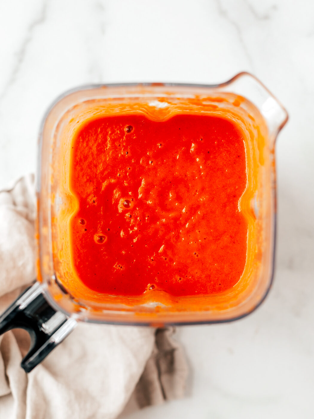 Soup blended up in a blender container.