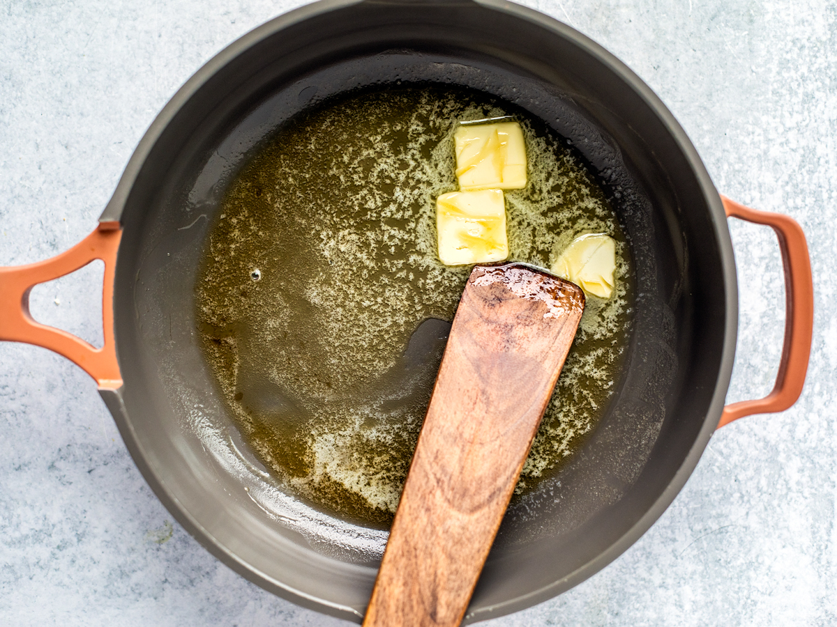 Skillet with sesame oil and melting butter.