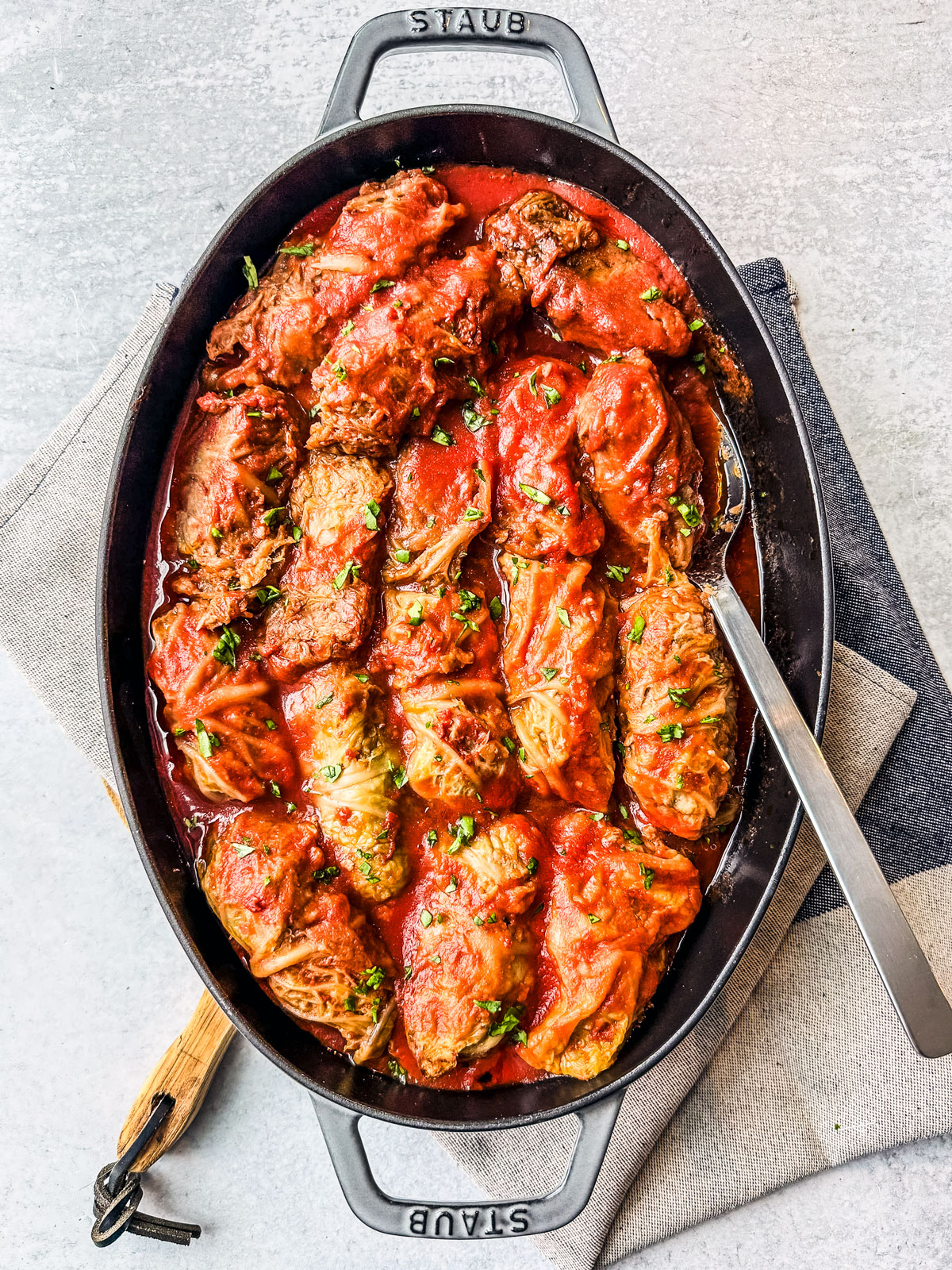Baking tray of Ukrainian cabbage rolls with ground beef.