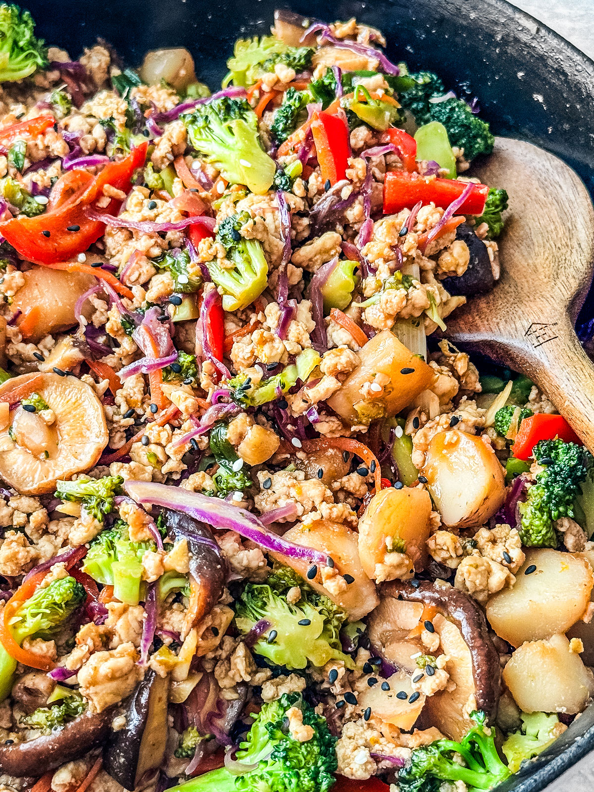 Close up of ground turkey stir fry with cabbage in a skillet.