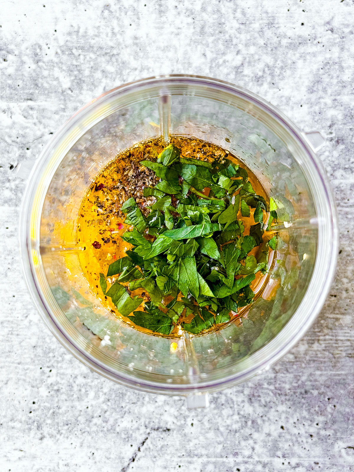 Ingredients for lemon vinaigrette in a small blender.