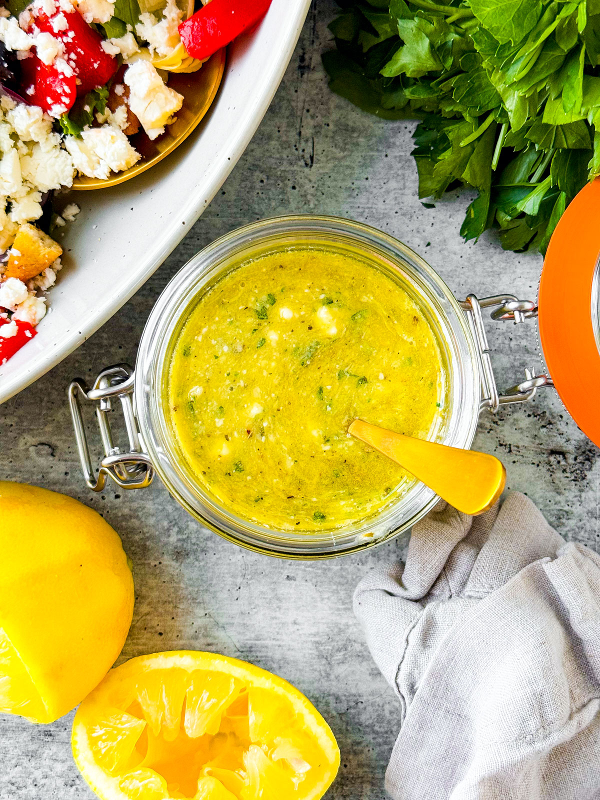 Overhead shot of jar of lemon vinaigrette with honey.