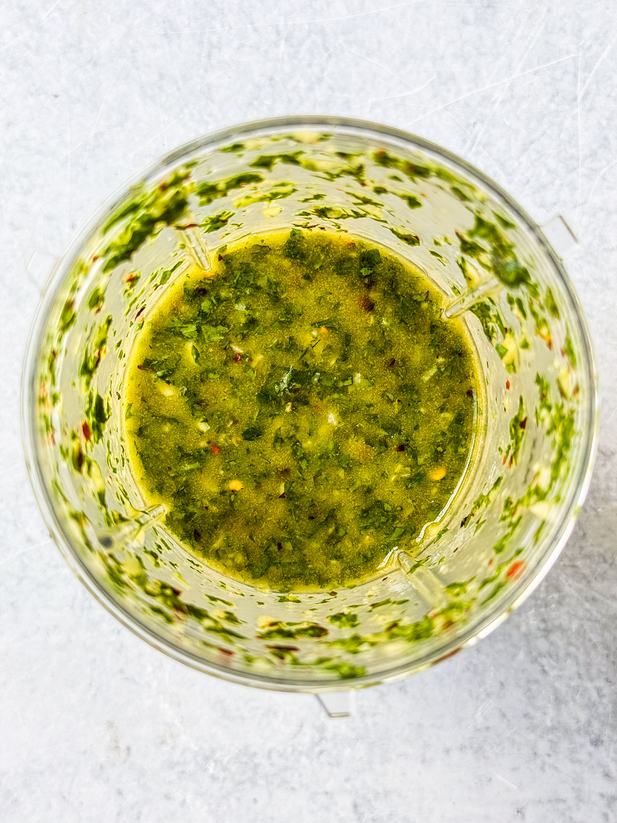 Blended chimichurri in a small bullet blender.