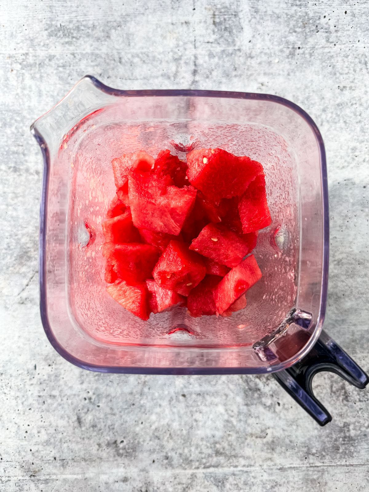 Watermelon cubes in a blender.