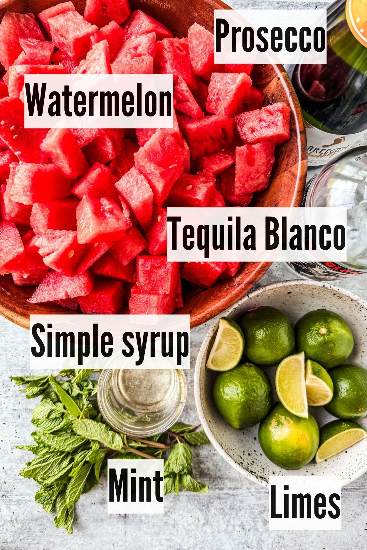 Ingredients for watermelon sangria on a countertop.