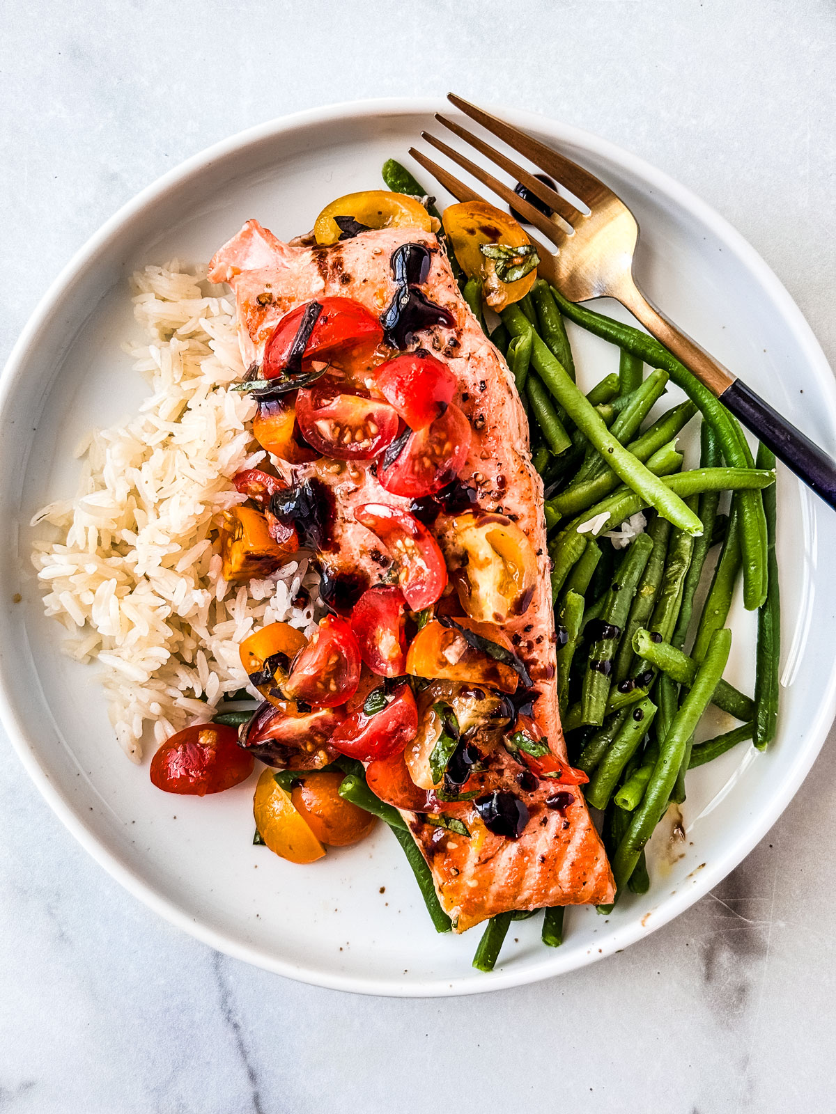 Grilled salmon topped with cherry tomato bruschetta.