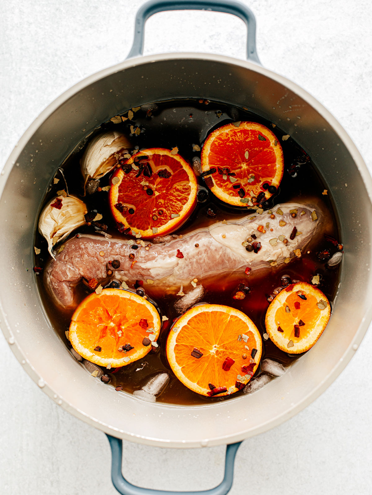 Pork tenderloin in pot of brine.