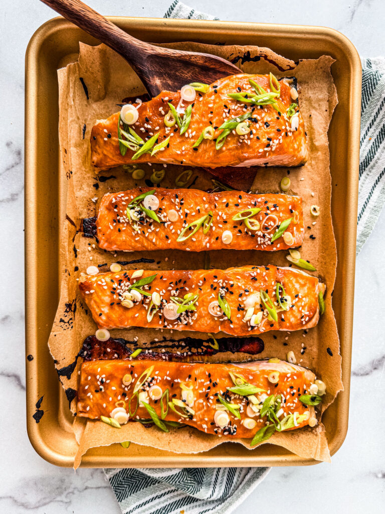 Salmon fillets on a baking sheet.