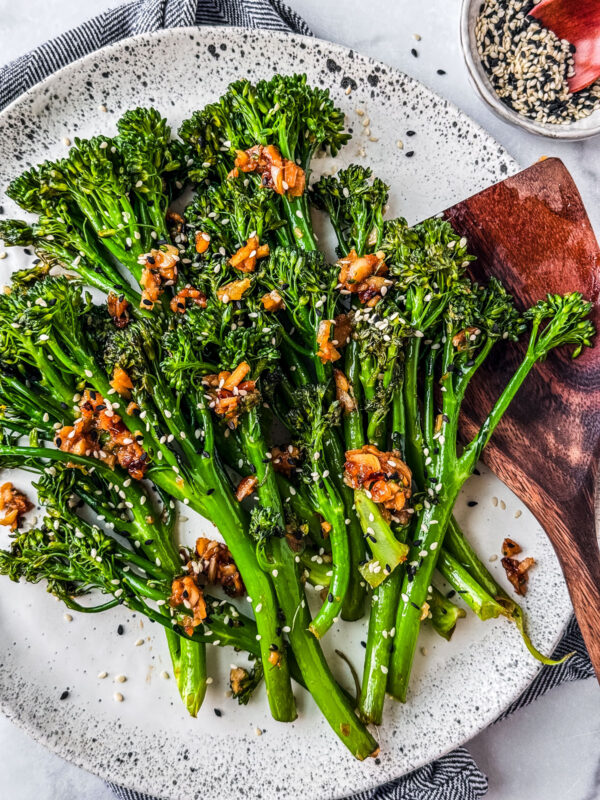 Garlic ginger sautéed broccolini on a serving platter.