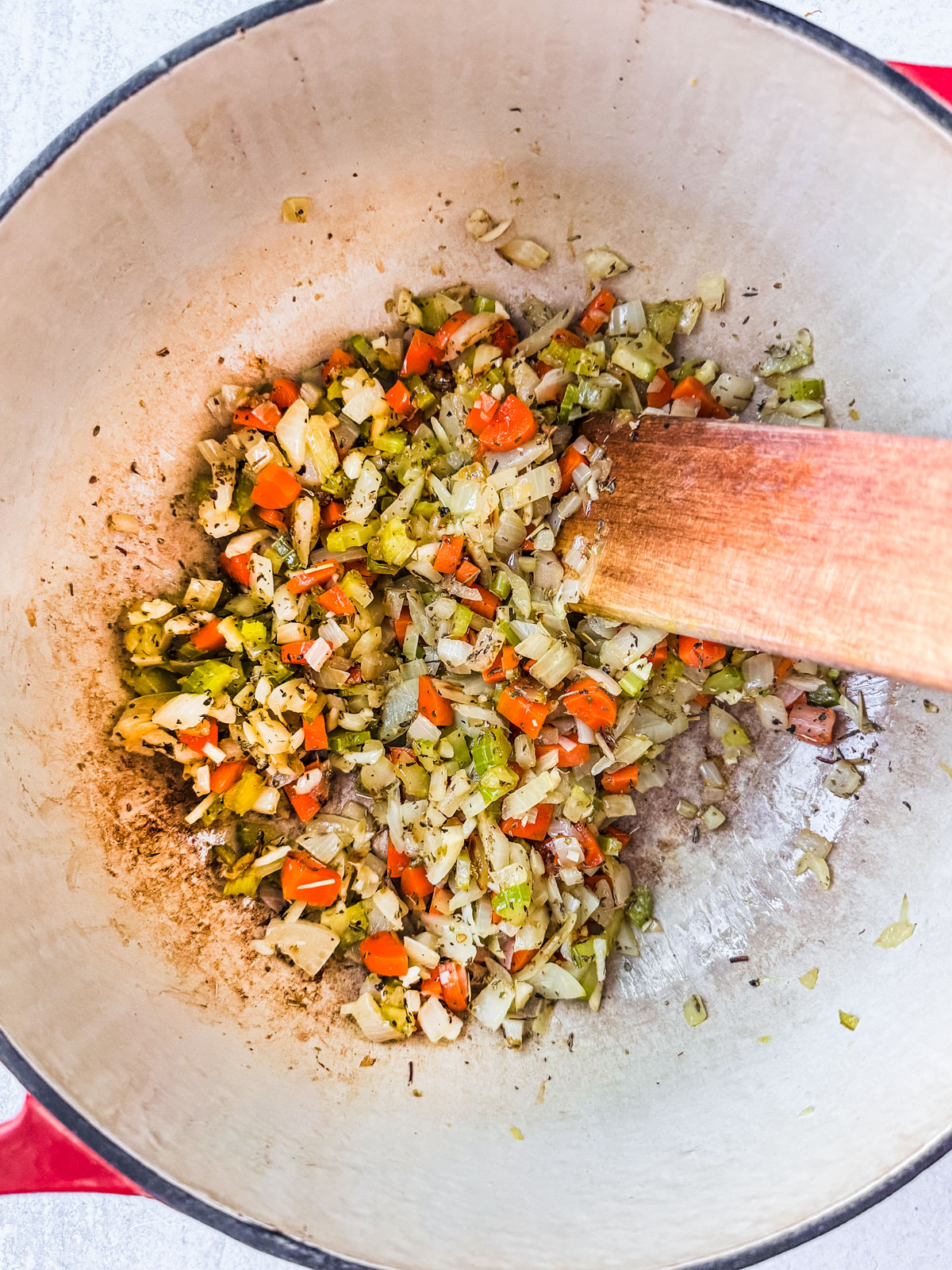 Pot of sauteed carrots, onions, and celery.