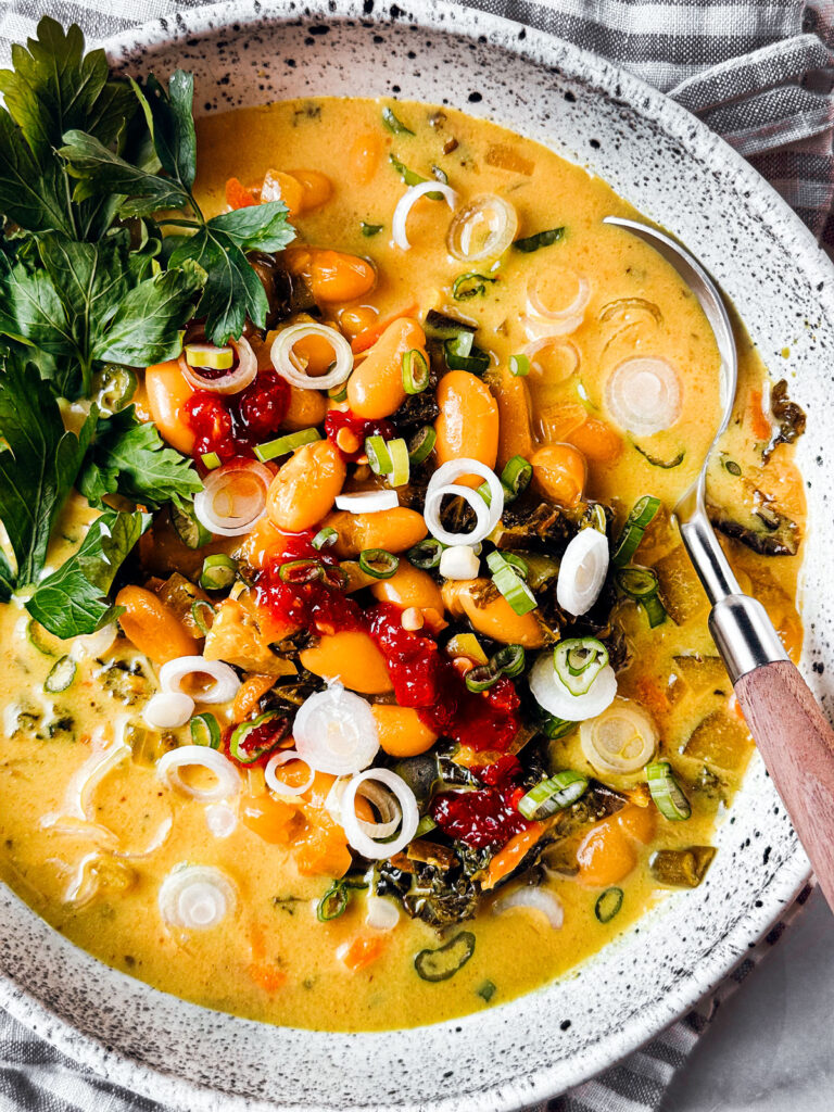 Kale and white bean Thai curry soup close up.