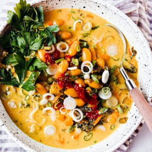 kale and white bean soup in a large bowl.