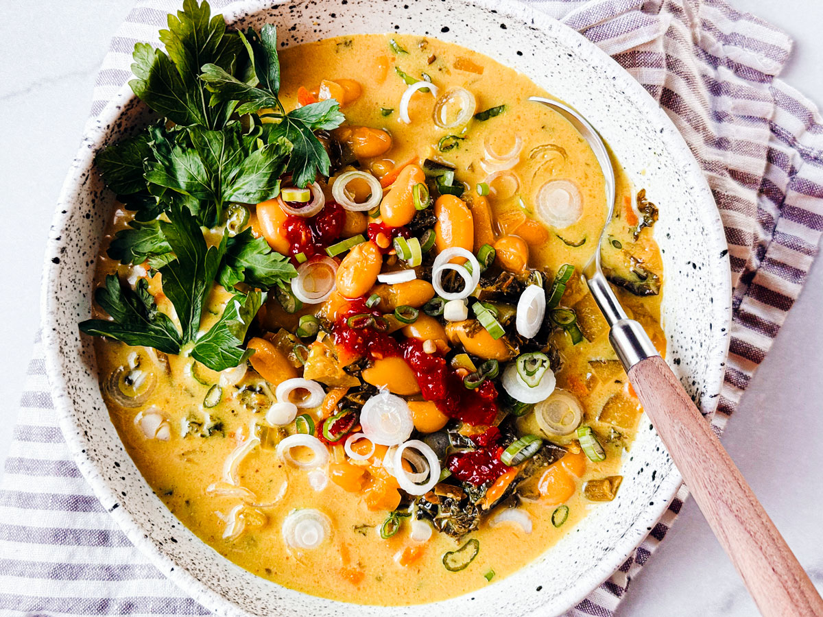 Bowl of kale and white bean Thai Curry soup.