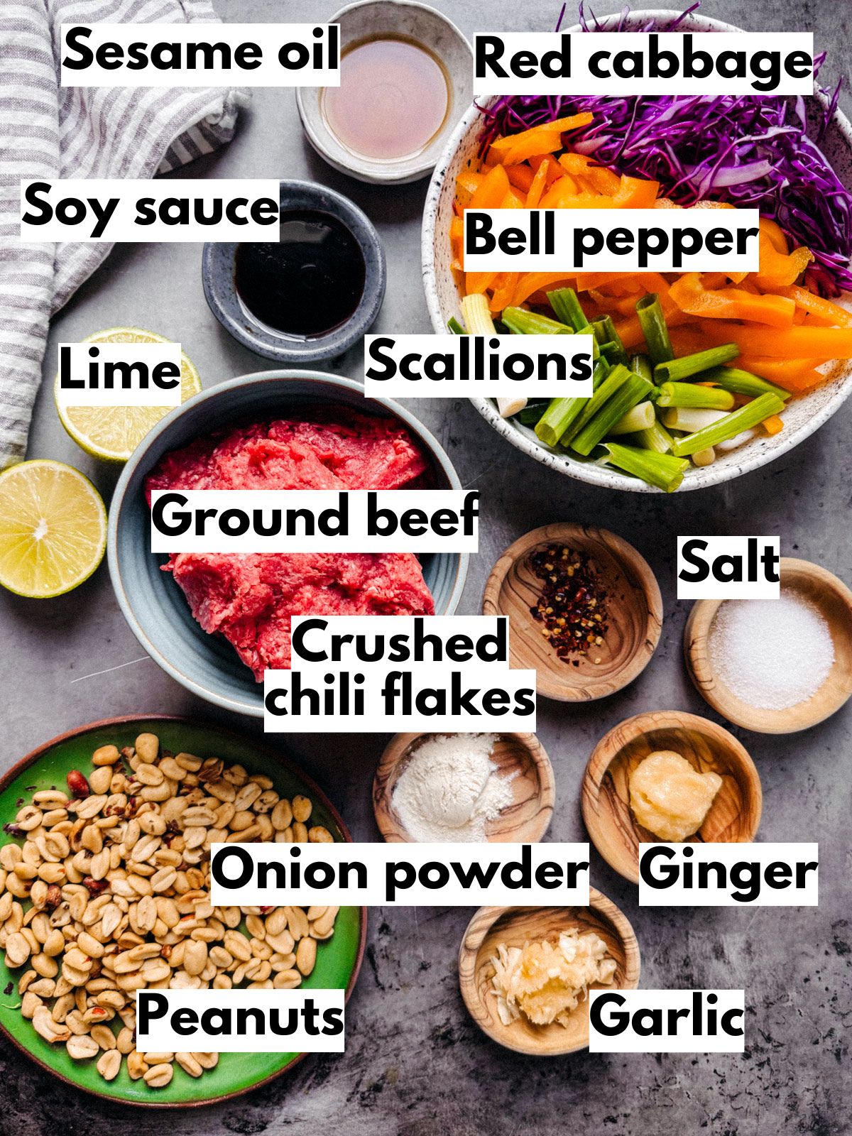 Ingredients for ground beef stir fry on a stone table.