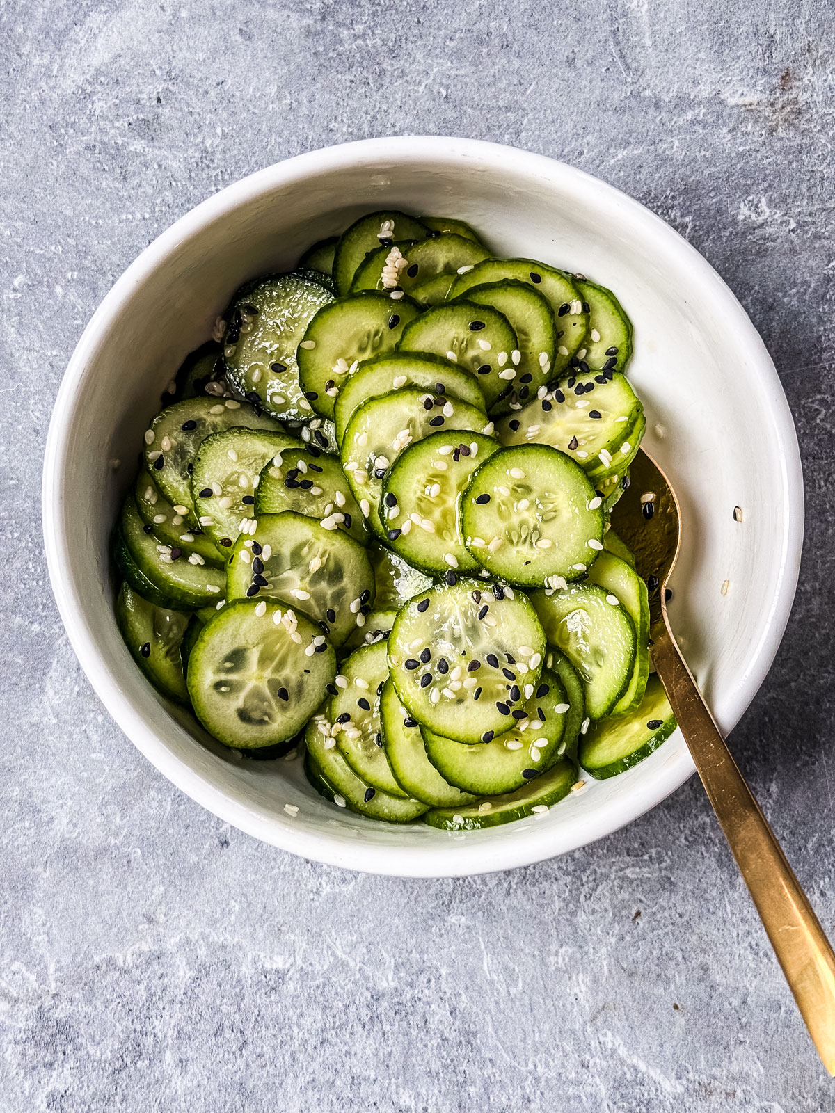 Small bowl with cucumber slices.